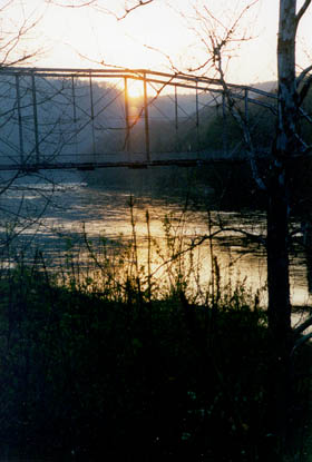 The Pond Eddy bridge at sunset.
