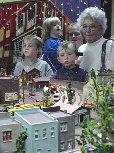Saurday visitors to the Stourbridge Model Railroad train layout are pictured watching the action on the table of Honesdale, PA, resident Ray Vogt’s model railroad set up.
